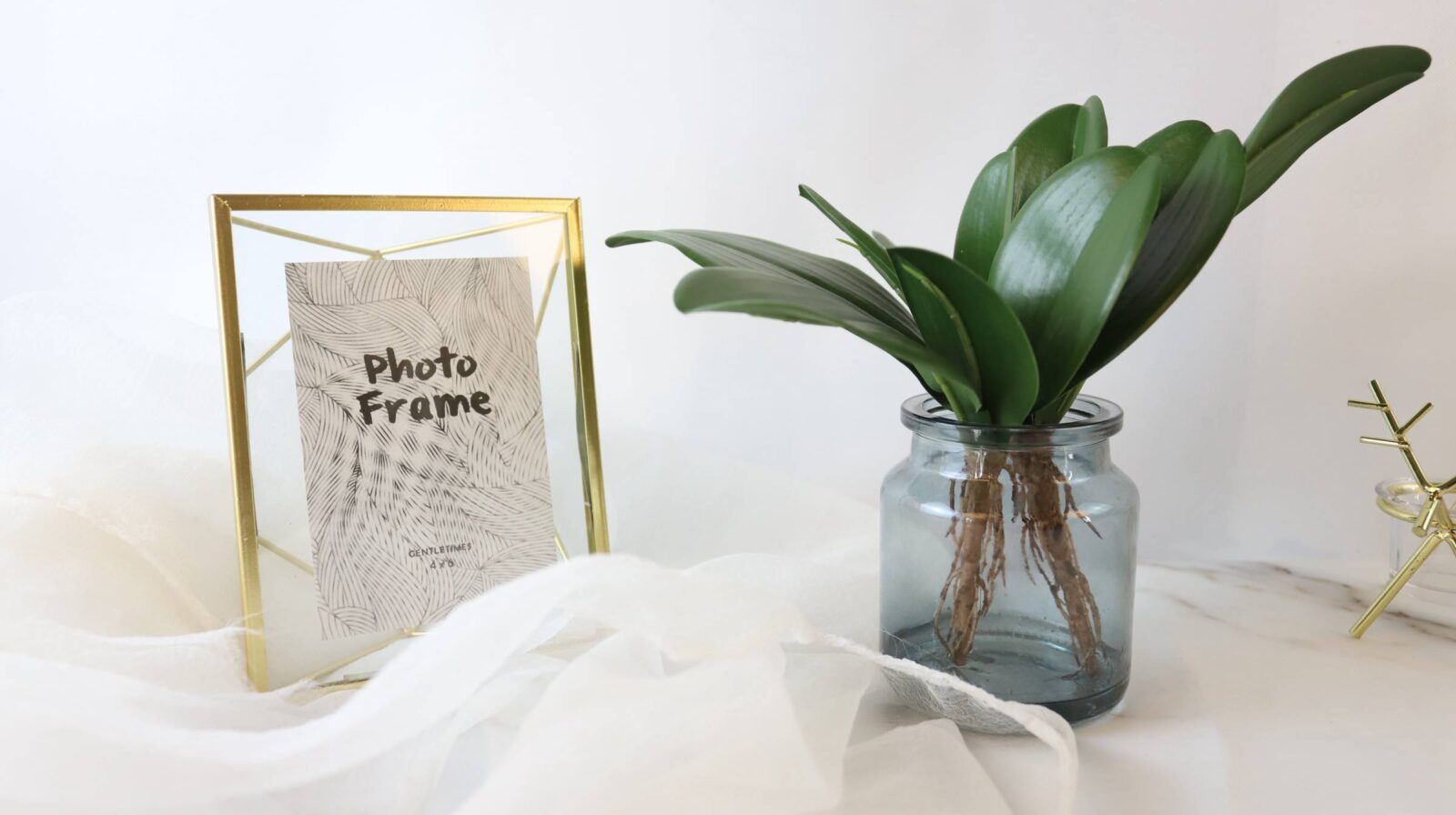 Fake Orchid Leaves Fixed in Glass Bottle - Image 4