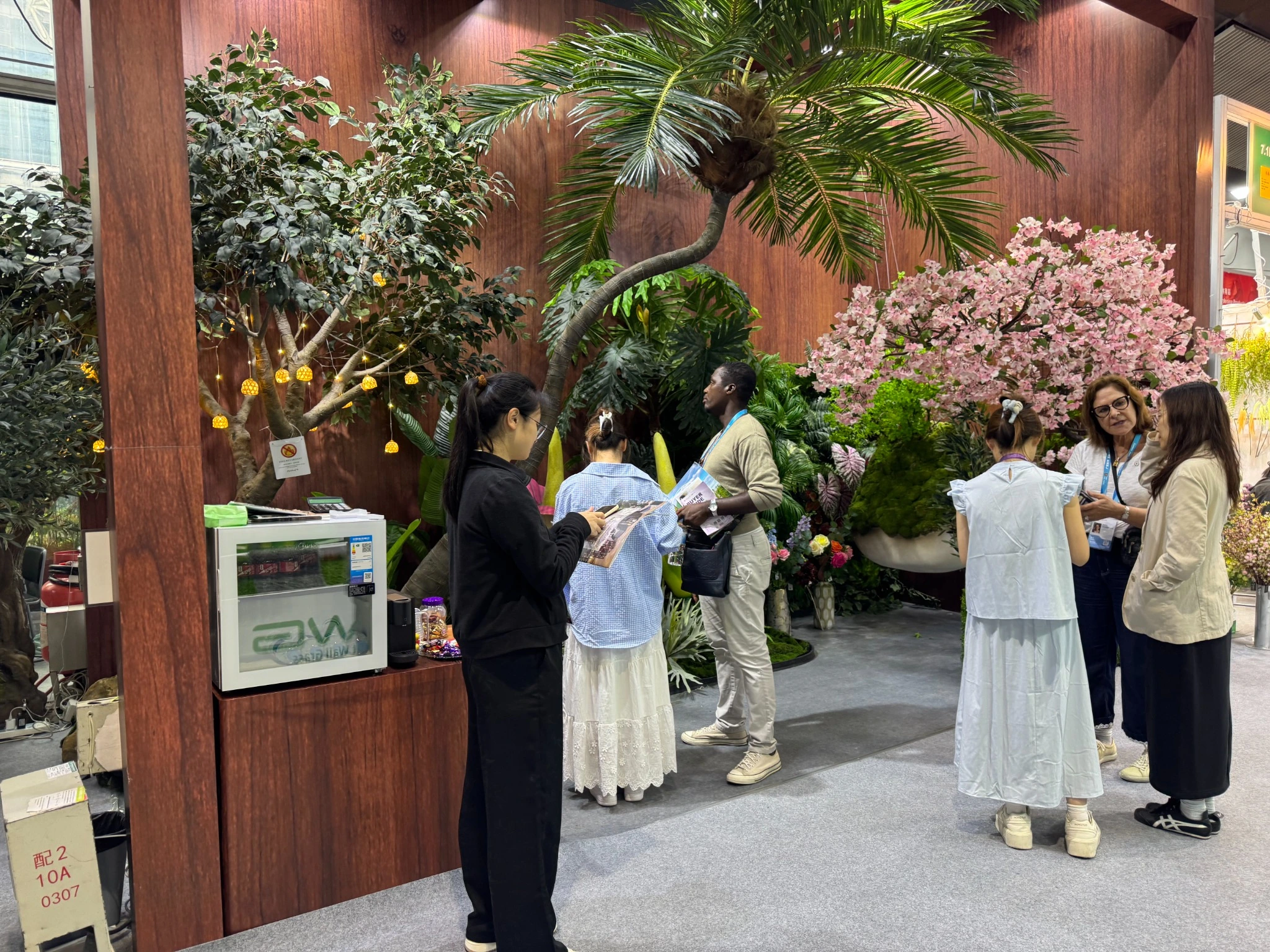 Artificial tree trade show booth with international buyers at the Canton Fair